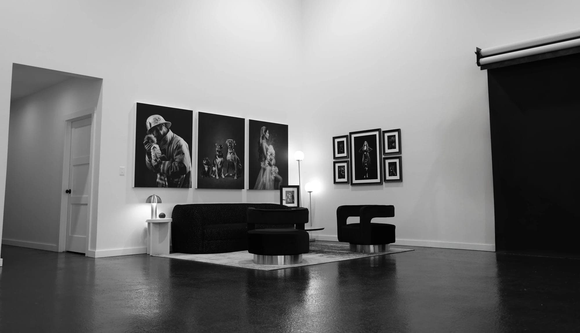 Portrait artwork and comfortable seating in the McKinney photography studio
